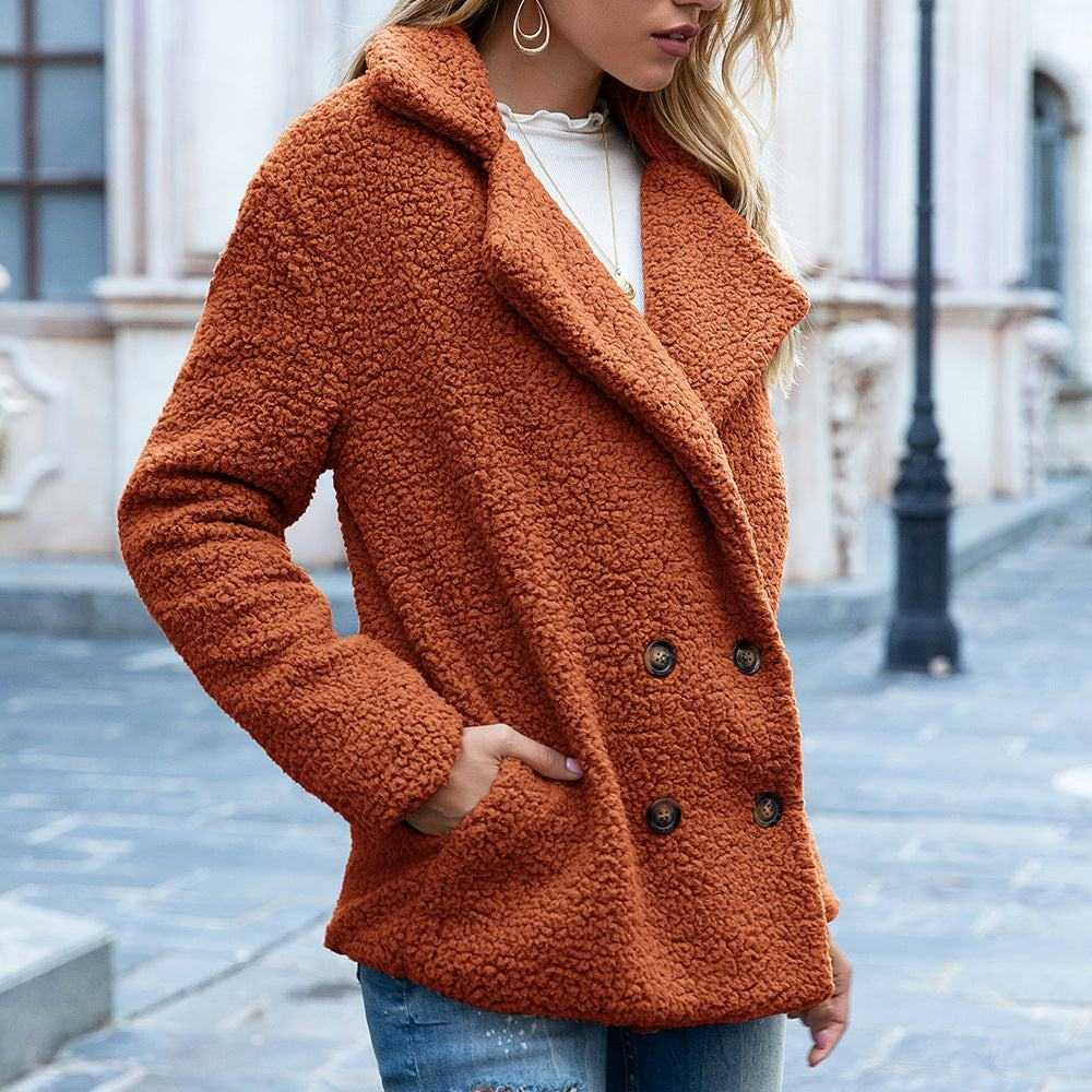 Women’s fluffy coat winter jacket in rust color with double-breasted buttons and side pockets, perfect for cold weather.