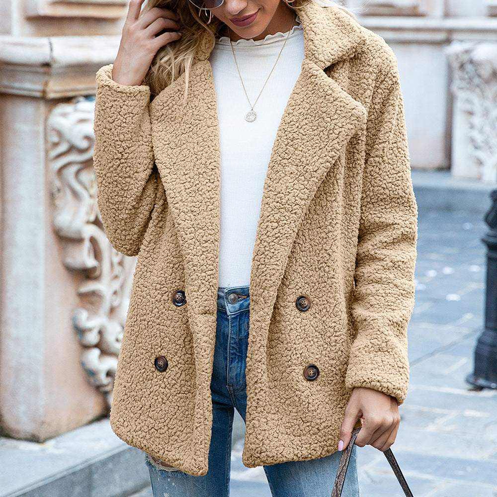 woman wearing beige fluffy coat winter jacket with double-breasted buttons and jeans outdoors