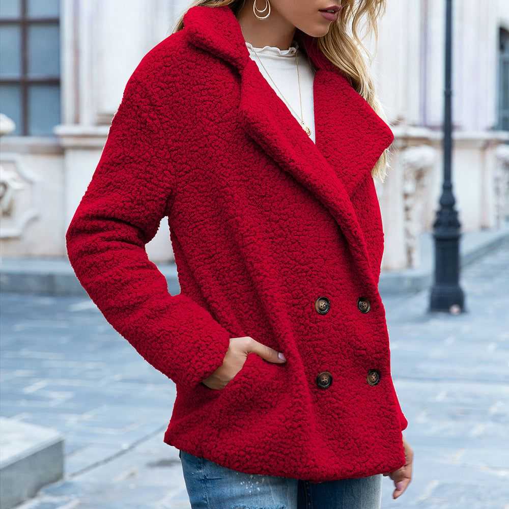Red fluffy winter coat jacket with double-breasted buttons and side pockets worn outdoors
