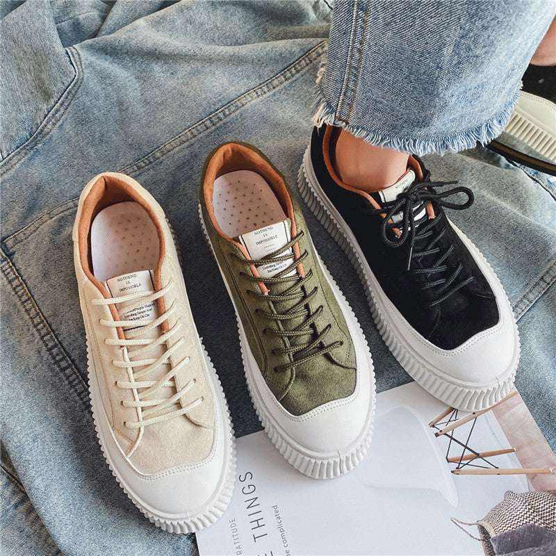 Hong Kong Sneakers in beige, olive green, and black with white soles displayed on denim fabric