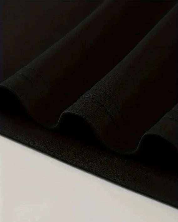 Close-up of black I'm Thinking T-shirts fabric with detailed stitching and smooth texture