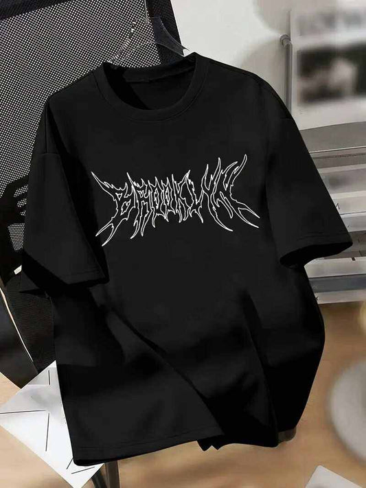 Black Brooklyn T-shirt with white graphic text design on front laid flat on a chair.