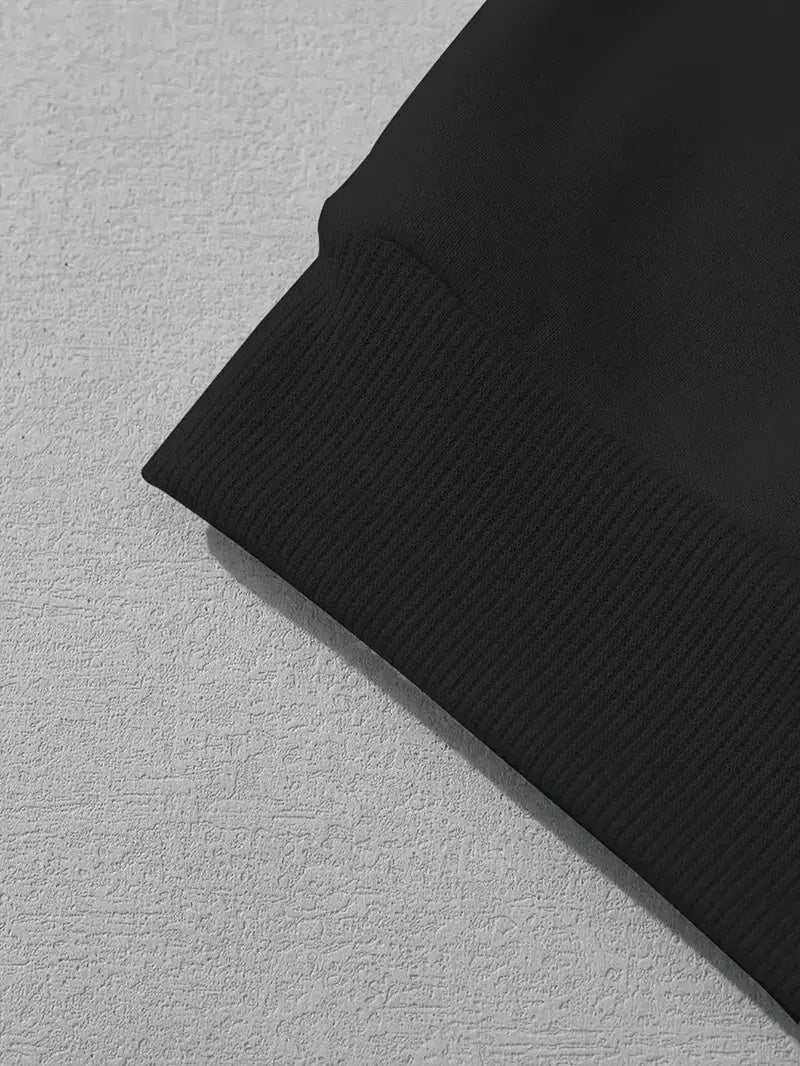 Close-up of black men's polyester hoodie cuff with ribbed fabric detail