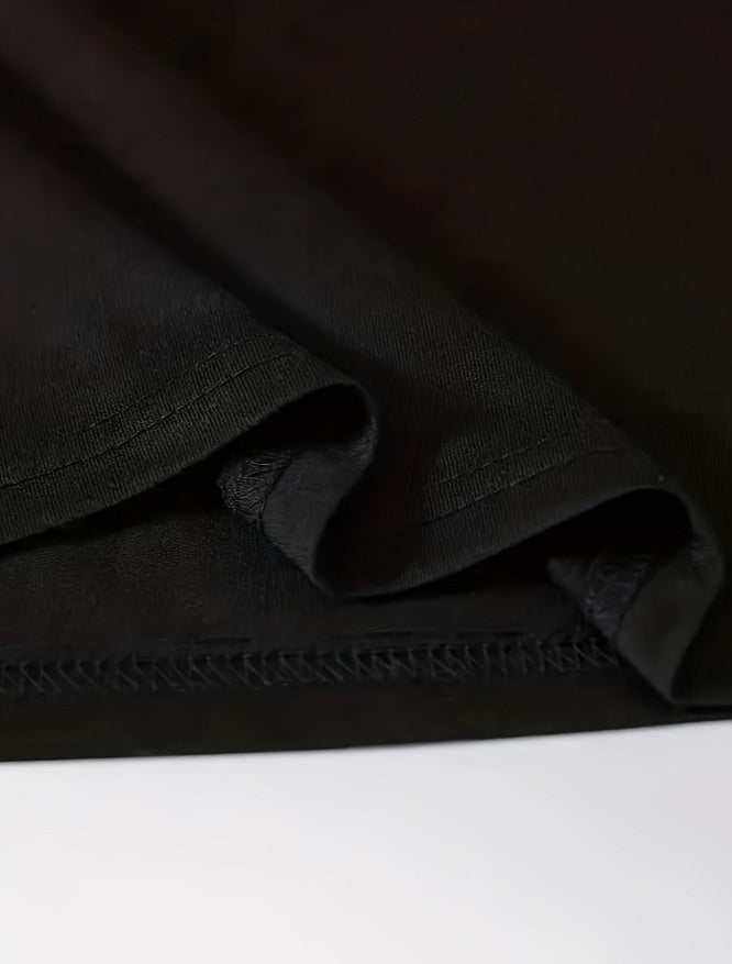 Close-up of black Chicken Nuggets T Shirt fabric showing material texture and stitching details