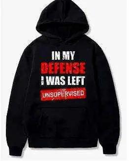 Black men's polyester hoodie with "In my defense I was left unsupervised" graphic text design