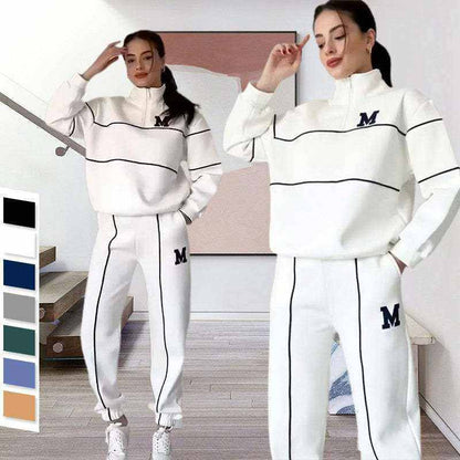 Women wearing white 2 Piece Lounge Hoodles set with black piping and "M" logo, styled for casual comfort.