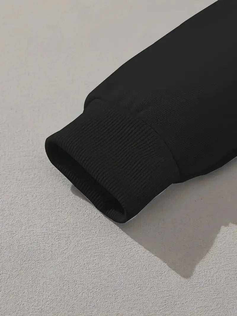 Close-up of black men's polyester hoodie sleeve cuff with ribbed detailing