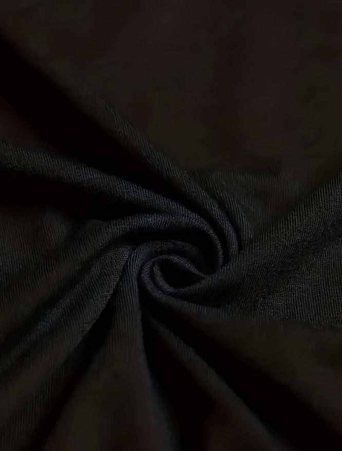 Black fabric close-up showing texture of Chicken Nuggets T Shirts material blend of polyester and spandex