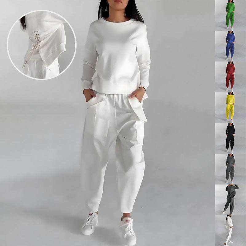 White fashion sweatshirt top with lace-up side detail, paired with matching pants and white sneakers, available in multiple colors.