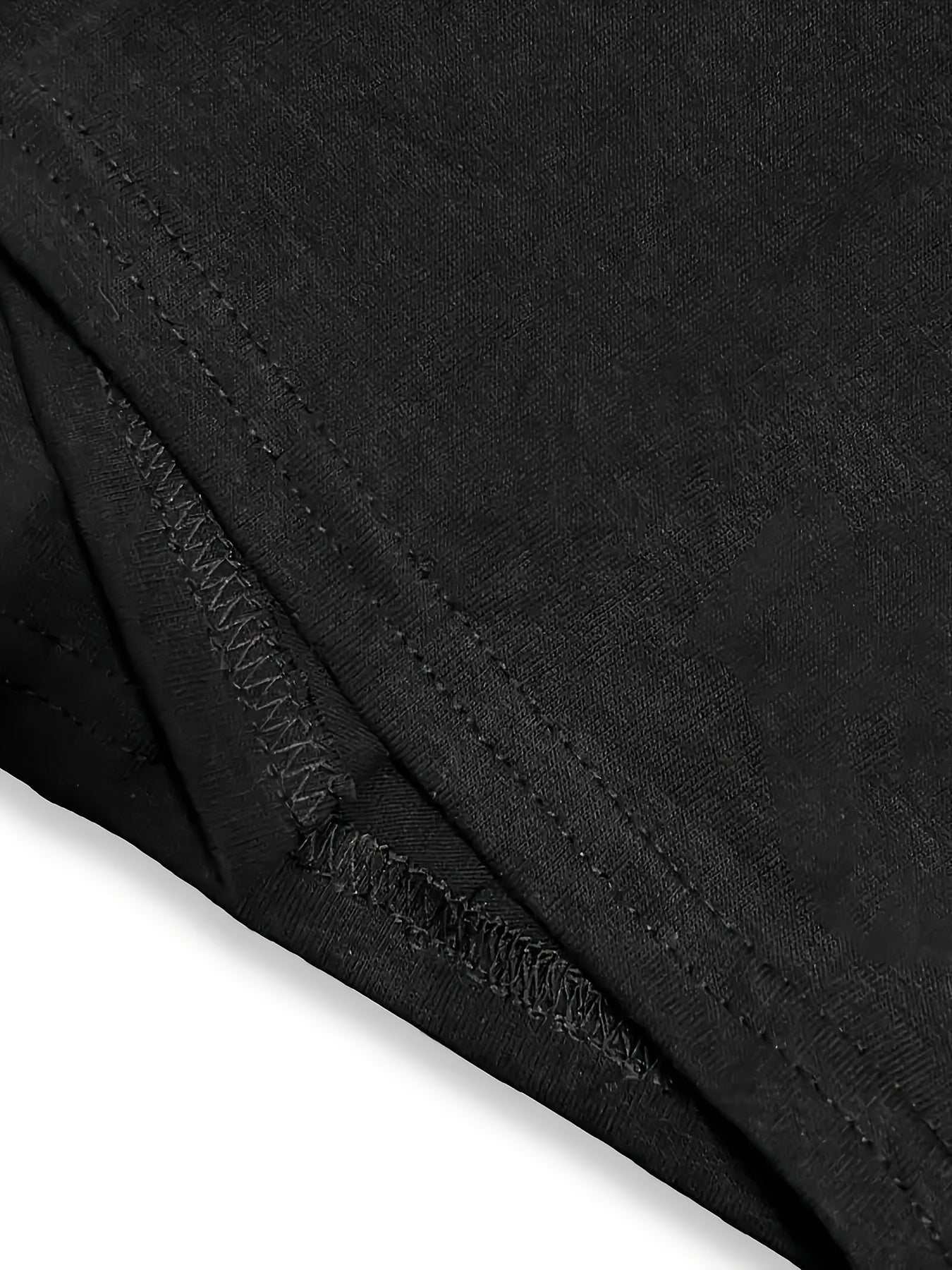 Close-up of black polyester and spandex fabric with detailed stitching on You Can't Handle These Nut short-sleeved retro printed top